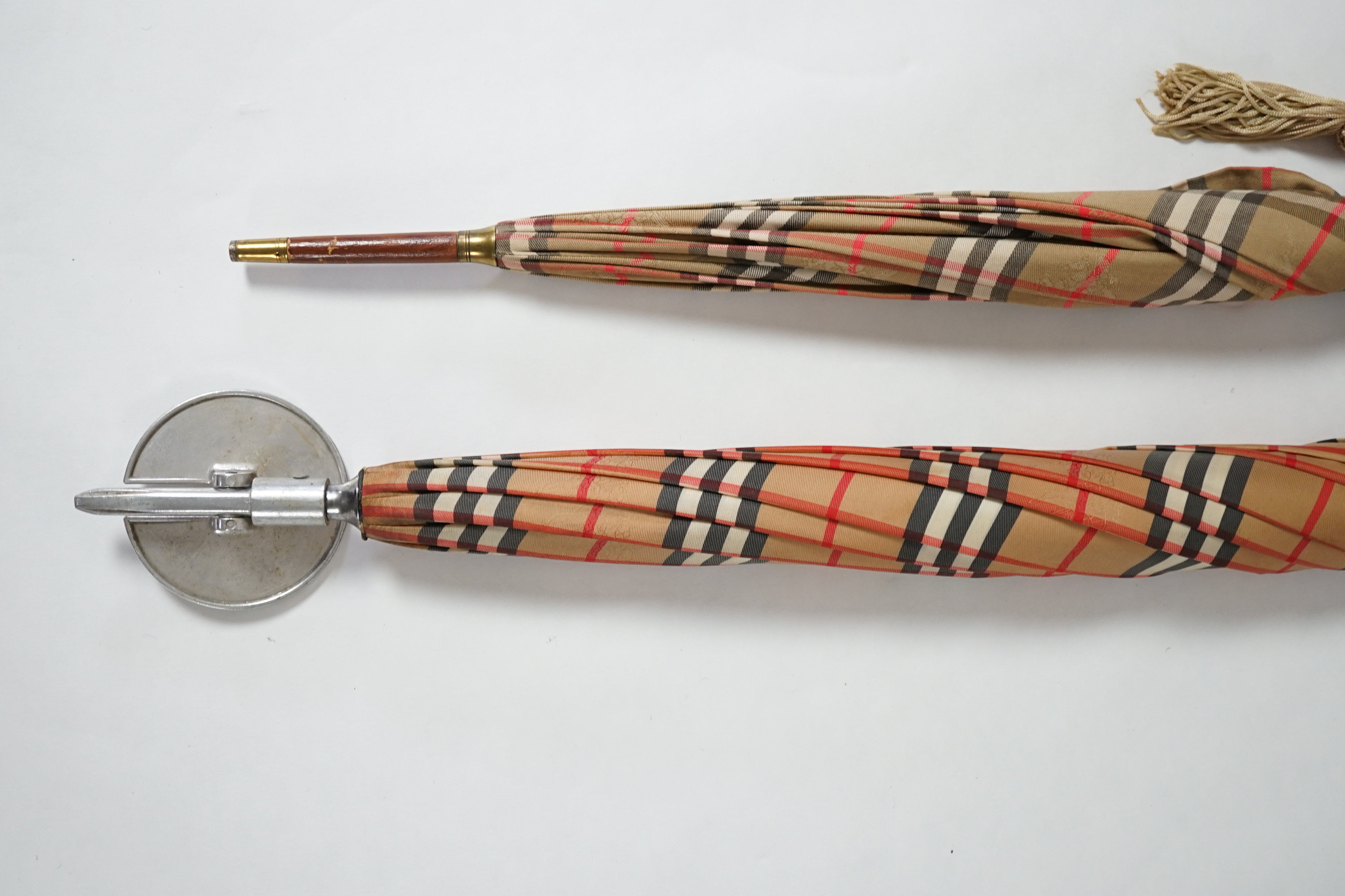 A vintage Burberry shooting stick umbrella and a lady's vintage cotton umbrella, shooting stick height 91cm, umbrella 83cm